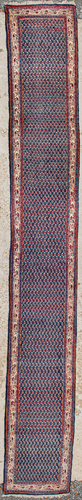 An Oriental hand-made runner carpet. Hamadan.