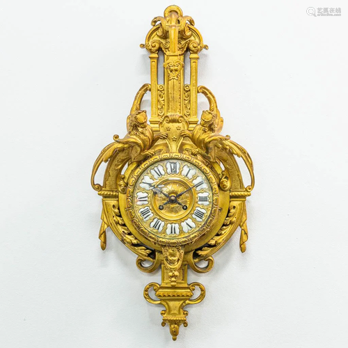 A cartel clock made of bronze in Louis XVI style. The