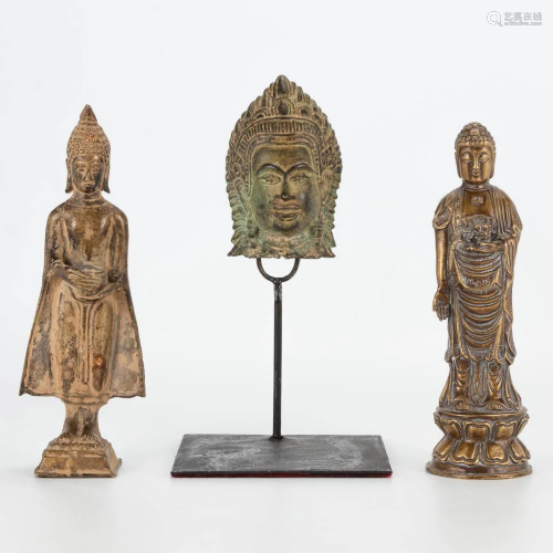 A collection of bronze statues, figurines of Buddha.