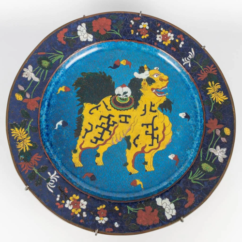 An antique cloisonne display plate with decor of a Foo