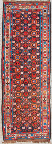 An Oriental hand-made runner carpet. Hamadan.