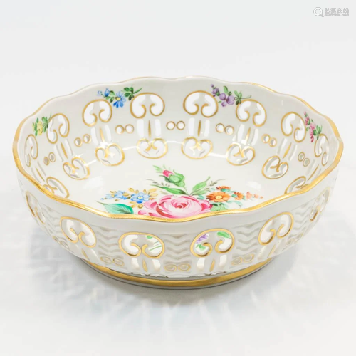 A bowl with hand-painted flower decor and ajour edges,