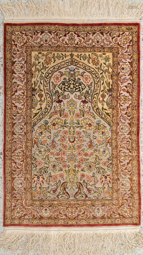 An Oriental hand-made prayer carpet made of silk and