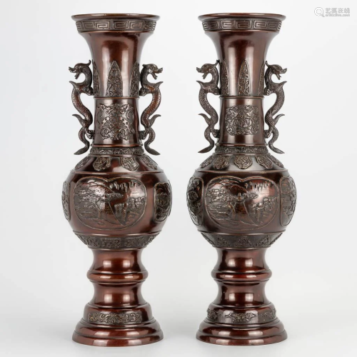 A pair of bronze Japanese vases decorated with