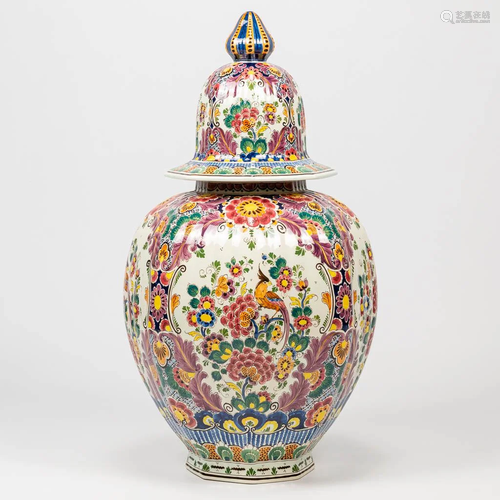 A porcelain vase with hand-painted decor and made by