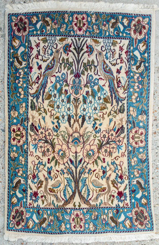 An Oriental hand-made carpet with birds.