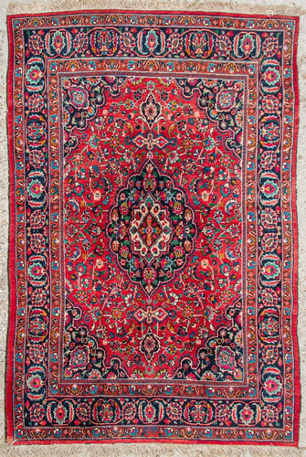 An Oriental hand-made carpet. Meshed. (297 x 203)