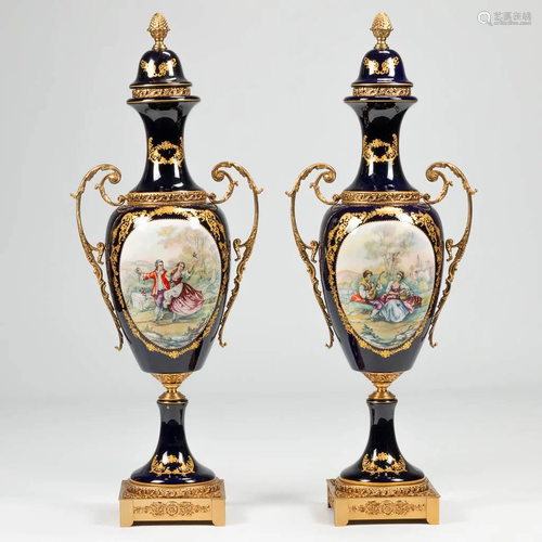 A pair of bronze mounted display vases in Sevres style.