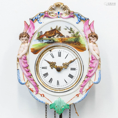 A 'Jockele' clock made of porcelain with putti and