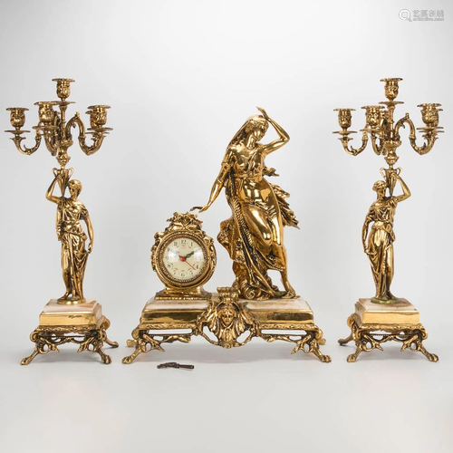 A 3 piece garniture clockset made of bronze with female