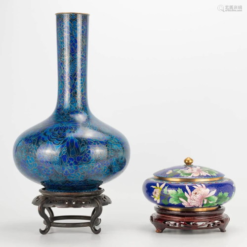 A collection of 2 cloisonne vases standing on a wood
