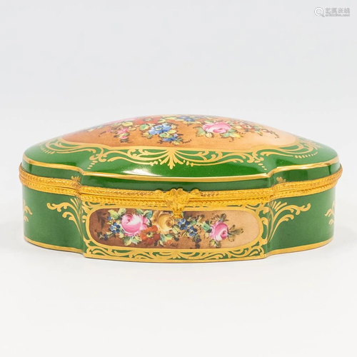 A porcelain trinklet box mounted with bronze and