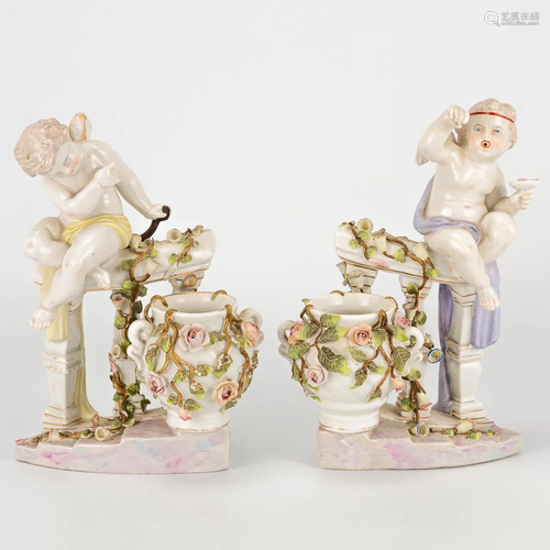 A pair of porcelain figurines of angels on a handrail