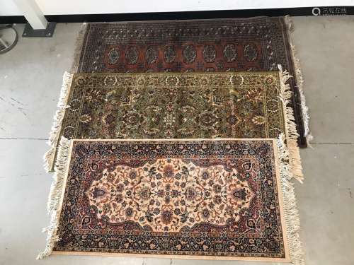 Three 20th Century woollen carpets, one Turkmen-style with b...