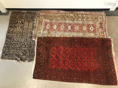 Three vintage middle eastern carpets, Including a Turkmen ex...