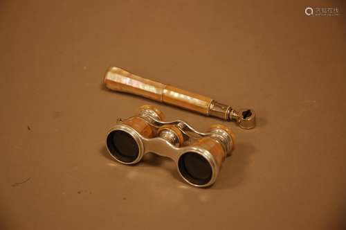 A pair of opera glasses, chromed frames with mother of pearl...