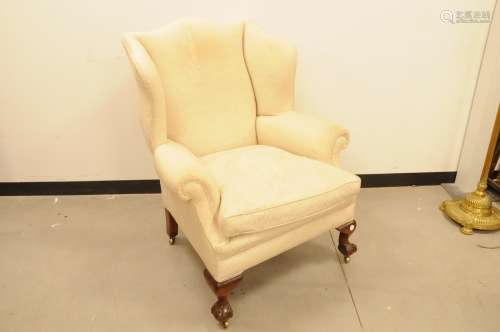 A second half 20th century upholstered wing back chair by Fr...