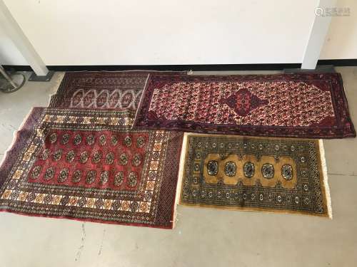 Four vintage middle eastern woollen carpets, including one r...