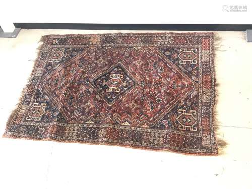 A vintage middle eastern woollen carpet, damaged, 196 cm x 1...