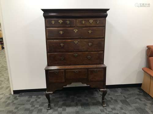 A late George III oak chest on stand, cross banded drawers w...
