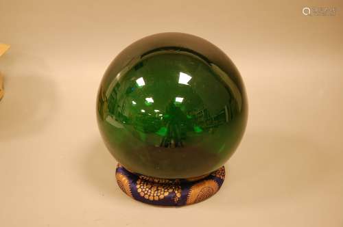 An early 20th century large green glass fishing float, appro...