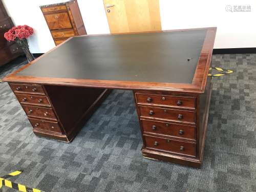 An early 20th century large partners desk, twin pedestals ha...