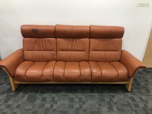 A modern bent ply and leather three seater reclining sofa fr...