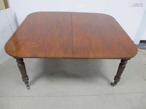 A 19th Century mahogany dining table, drawer leaf action, ro...