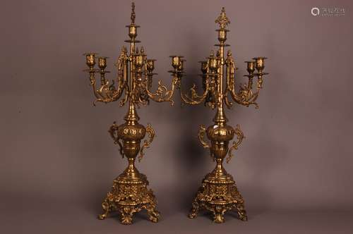 A pair of mid 20th century brass candelabra, 69cm, five bran...