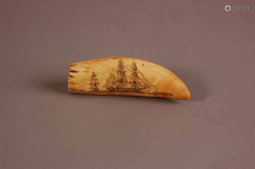 A 19th century scrimshaw sperm whale's tooth, 13cm, with eng...