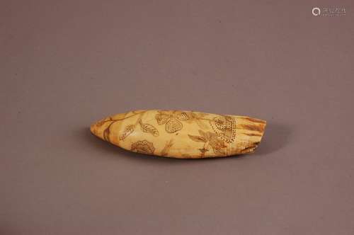 A 19th century scrimshaw sperm whale's tooth, 13.5cm, engrav...