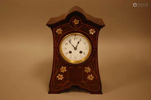 An Art Nouveau period mahogany and inlaid mantle clock, 32cm...