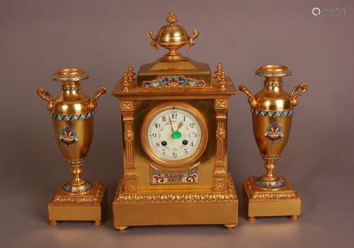 A late 19th century French gilt and champleve clock and garn...