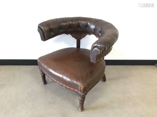 A 19th Century leather club chair, damaged to legs and frame...