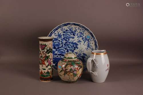 A large Japanese Arita style blue and white porcelain charge...