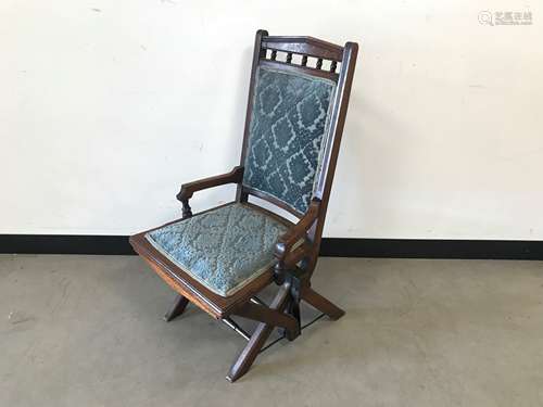 A Victorian and later mahogany and upholstered rocking chair...