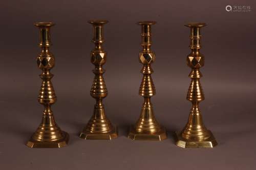 Two pairs of Victorian brass candlesticks, 30cm, two with ru...