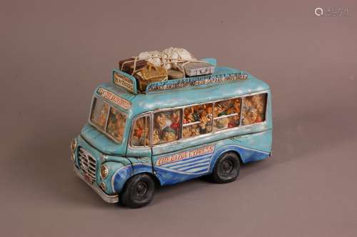 A modern ceramic comical sculpture of a tourist bus by Guill...