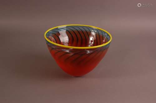 A large modern Kosta Boda glass bowl, in orange with blue st...