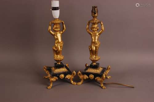 A pair of early 20th century continental figural lamp bases,...