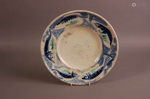 A mid 20th century studio pottery dish, 36cm, with sgraffito...