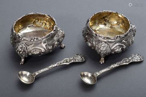 Pair of English salt cellars in rich relief on three feet wi...