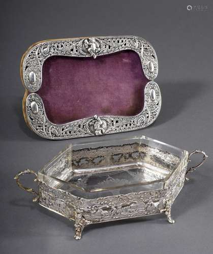 2 Various richly reliefed pieces: openwork frame with putti ...