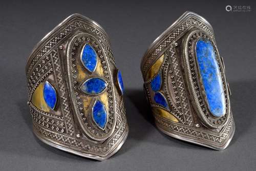 2 Various Afghan bangles, each with tapered central part and...