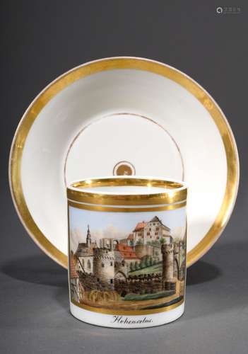 A detailed painted porcelain view cup/saucer with gold frame...