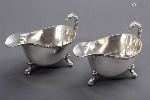 Pair of small English sauce boats with zoomorphic handles an...