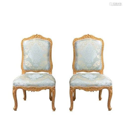 A pair of wood armchair