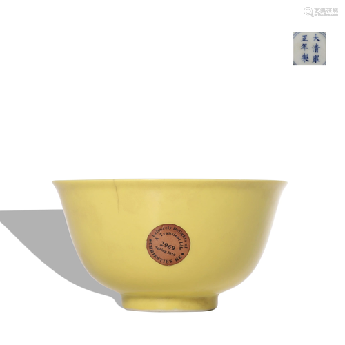 A yellow glazed cup