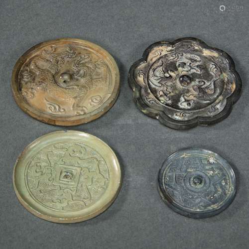 A GROUP OF CHINESE BRONZE MIRRORS FROM, WARRING STATES PERIO...