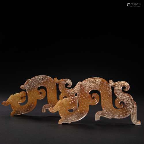 A PAIR OF CHINESE HETIAN JADE DRAGON-SHAPED JADE PENDANT FRO...